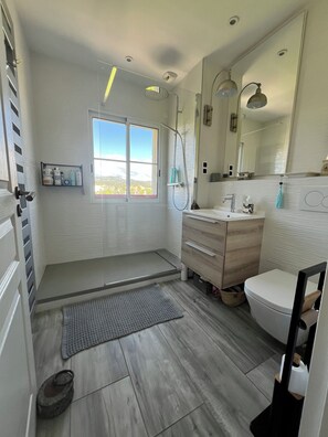 Shower, hair dryer, towels, soap