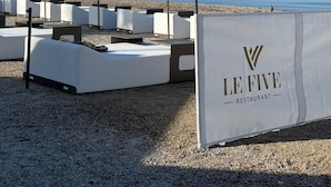 Outdoor seating with a sign for Le Five Restaurant. - LE VICTORIA SANARY CENTER TOP FLOOR SEA VIEW<br>SPACIOUS ELEGANT APARTMENT (Sanary-sur-Mer)