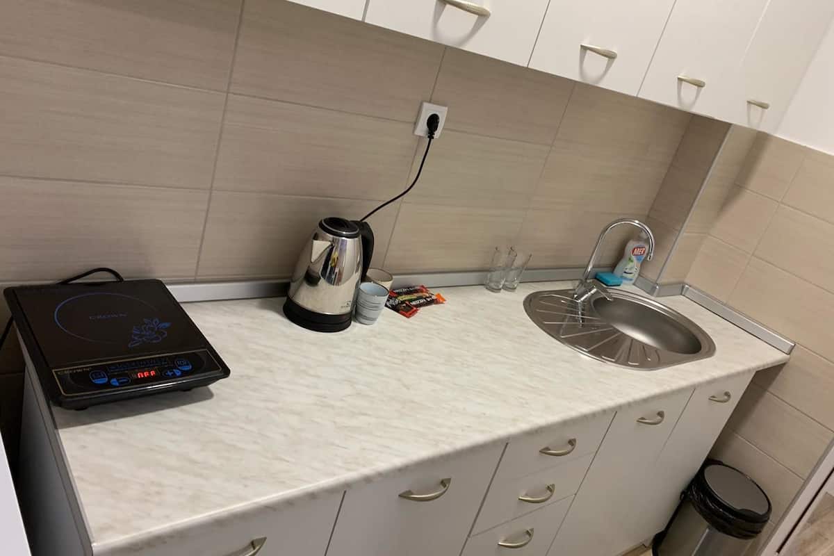 deluxe apartment | private kitchen | fridge, stovetop, electric kettle, cookware/dishes/utensils