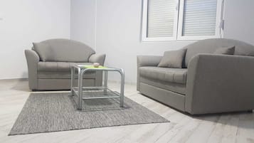 Superior Apartment | Living room | Flat-screen TV