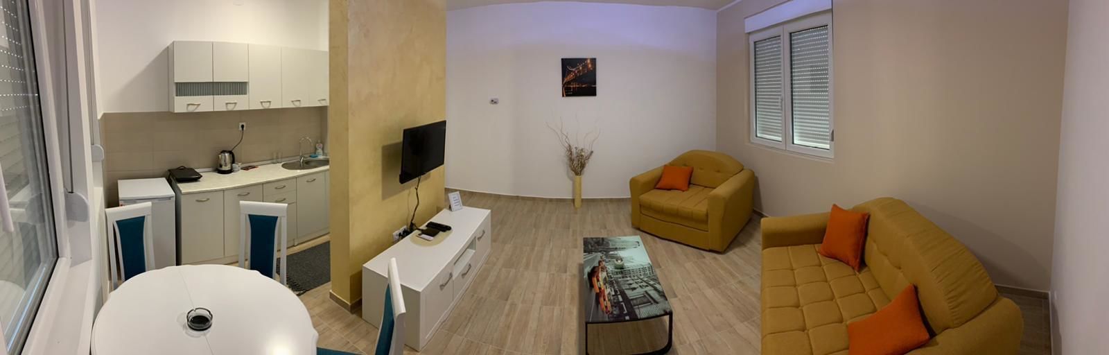 deluxe apartment | living area | flat-screen tv
