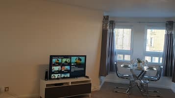 Apartment, 1 Bedroom | Living area | 42-inch Smart TV with digital channels, TV, DVD player