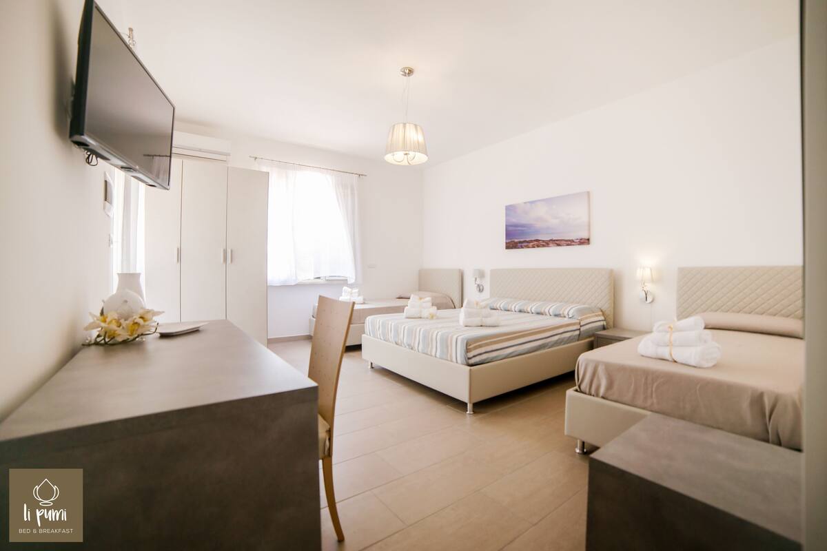 Habitación cuádruple (Pumo Bianco) | Ropa de cama de alta calidad, edredón y minibar