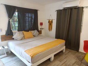 Family Triple Room | Pillow-top beds, blackout curtains, iron/ironing board, free WiFi