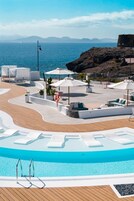 Outdoor pool, open 10:00 AM to 6:00 PM, pool umbrellas, pool loungers