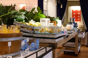 A buffet setup with various food items and beverages. - Seventy Barcelona (Barcelona)