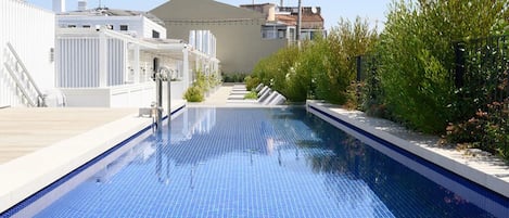 Seasonal outdoor pool, open 9:00 AM to 9:00 PM, sun loungers