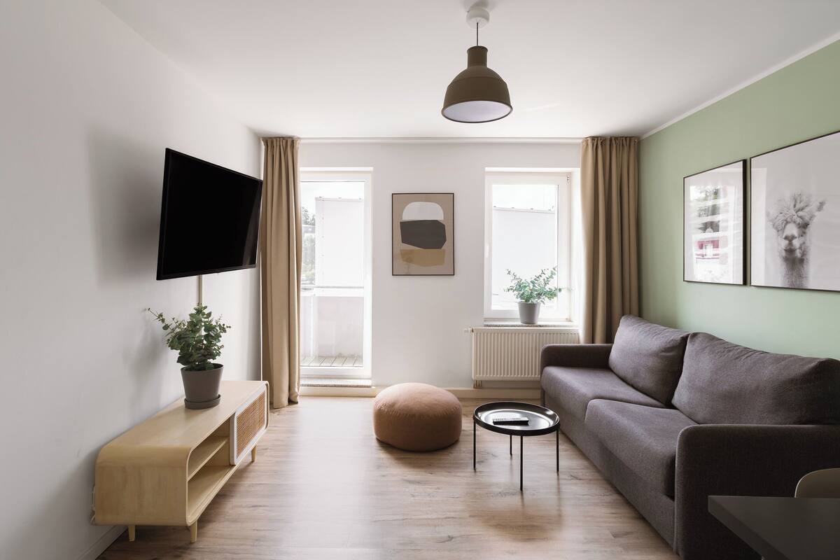 One-Bedroom Suite with balcony | Living area | Smart TV