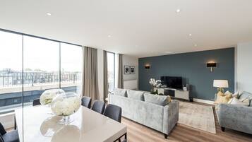 Luxury Apartment, 4 Bedrooms | Living area | TV