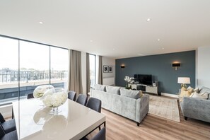 Luxury Apartment, 4 Bedrooms | Living area | TV