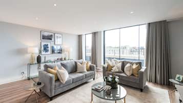 Superior Apartment, 4 Bedrooms | Living area | TV