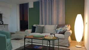 Comfort Double Room Single Use | Living area | 40-inch LCD TV with satellite channels, TV, Netflix - Beautiful Apartments Hayarkon st (Tel Aviv)