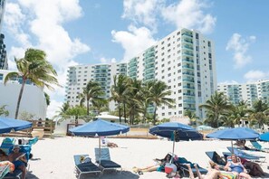 On the beach, sun-loungers, beach towels