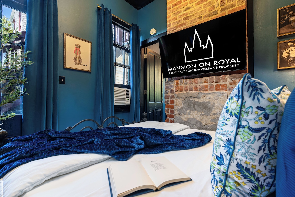 Premium bedding, desk, laptop workspace, iron/ironing board