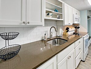 Fridge, microwave, stovetop, coffee/tea maker