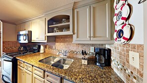 Fridge, microwave, stovetop, coffee/tea maker