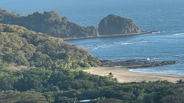 A coastal landscape with rocky outcrops and a beach. - Safe double gated properity with amazing views (Garza)