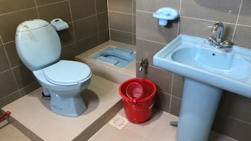 Economy Room | Bathroom | Rainfall showerhead, slippers, towels