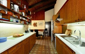 Fridge, stovetop, dishwasher, coffee/tea maker