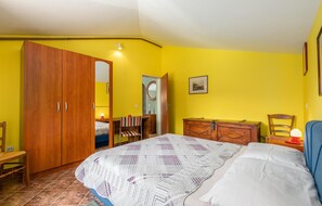 A bedroom with a bed, a wardrobe, a desk, and a chair. - Awesome apartment in Porec (Porec)