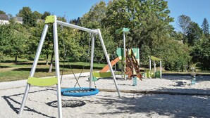 A playground with swings, slides, and climbing structures. - Stunning home in Lonlay l'Abbaye (Lonlay l'Abbaye)