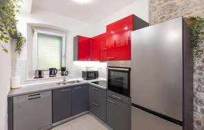 Fridge, stovetop, dishwasher, coffee/tea maker