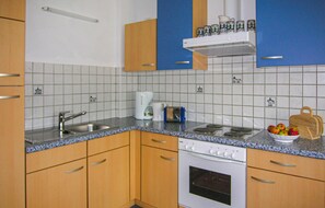 Enjoy cooking in this well-equipped kitchen with a sink, stovetop, oven, coffee maker, and toaster.