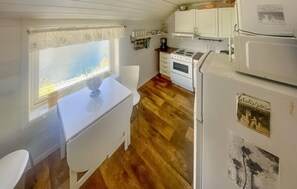 Fridge, stovetop, dishwasher, coffee/tea maker