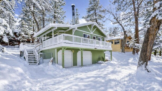 A green house with a balcony, a chimney, and a garage. - Good Times #1295 (Big Bear City)