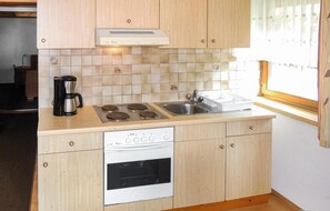 Fridge, stovetop, coffee/tea maker, cookware/dishes/utensils