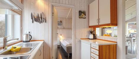 Fridge, stovetop, dishwasher, coffee/tea maker