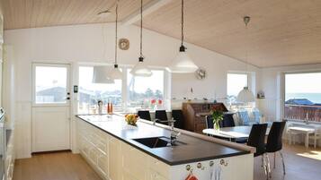 Fridge, stovetop, dishwasher, coffee/tea maker