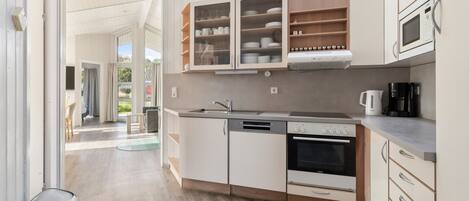 Fridge, stovetop, dishwasher, coffee/tea maker