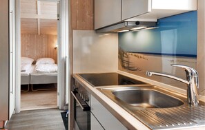 Fridge, stovetop, dishwasher, coffee/tea maker