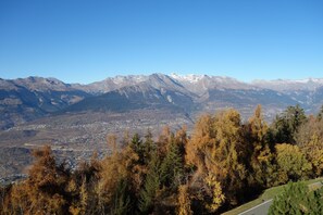 A mountainous landscape with a town in the valley below. - Mayens de l'Ours CZ 031 - MOUNTAIN apartment 6 per (Les Agettes)