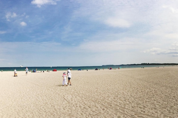 On the beach, water skiing