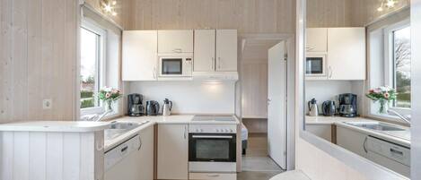 Fridge, stovetop, dishwasher, coffee/tea maker