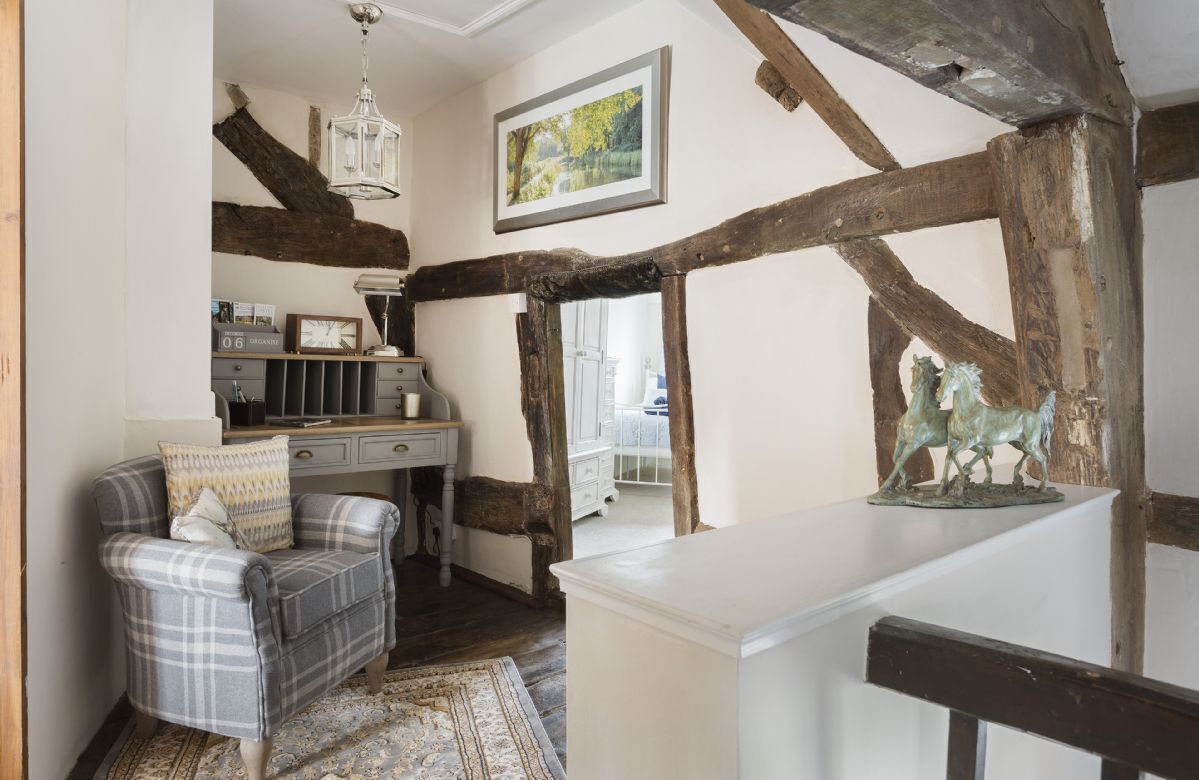 First floor: Peaceful landing area and low doorway into the twin bedroom