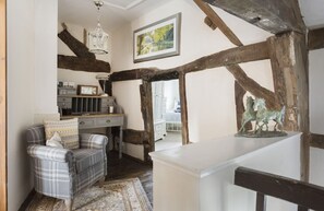 First floor: Peaceful landing area and low doorway into the twin bedroom