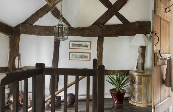First floor: Original staircase leading to the landing area