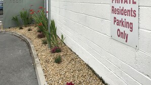 A sign indicating private resident parking.