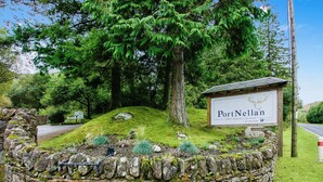 A stone wall with a sign reading "PortNellan" and a smaller sign below it. - Beautiful 5 star, 2 bedroom, 2 bathroom chalet with stunning views and wood burning stove (Crianlarich)