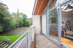 Balcony with front seat view of the canal lock