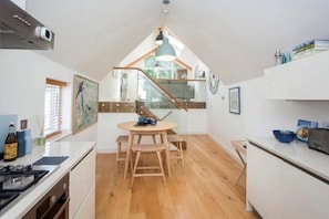Enjoy cooking in this well-equipped kitchen with a central island and dining area.
