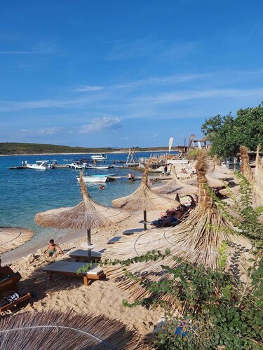 Ferienwohnung nur 500 Meter bis zum Sandstrand mit Waschmaschine, Klima, Liegestühlen, Garten und Grill