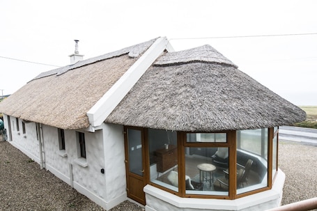 Terrace/patio. Authentic Thatched Cottage with great views near Cliffs of Moher