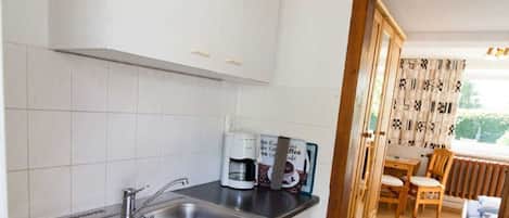 Fridge, coffee/tea maker, electric kettle, toaster
