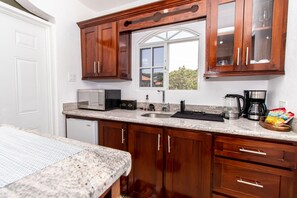 Microwave, coffee/tea maker, cookware/dishes/utensils