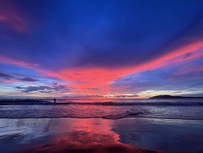 On the beach, sun-loungers