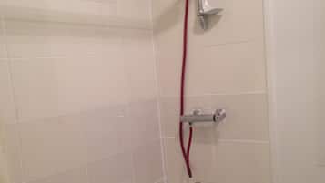 Bathtub, hair dryer, towels, soap
